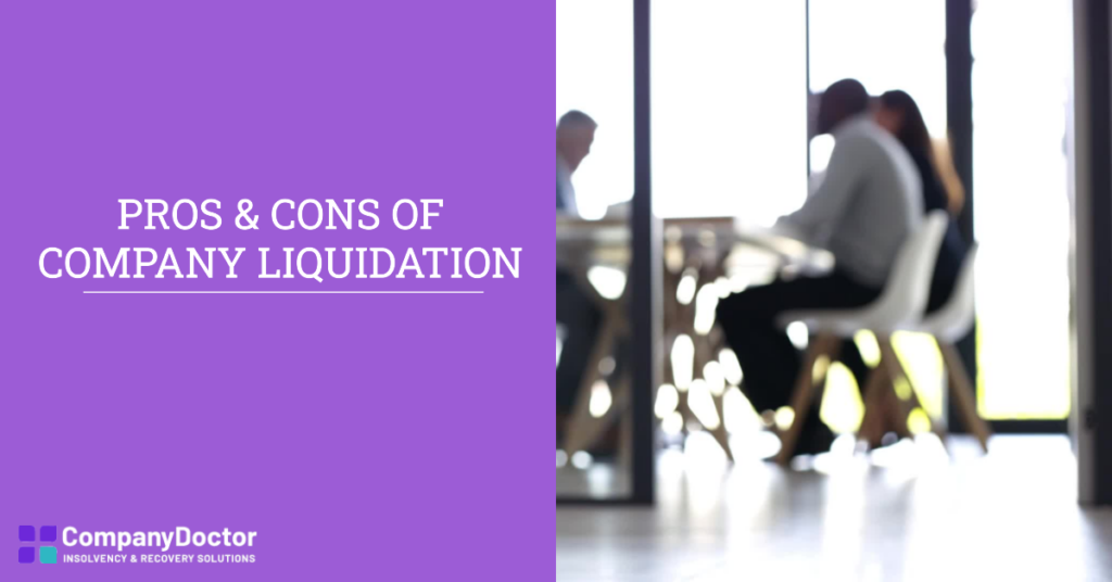directors sat at a table discussing the pros and cons of company liquidation.