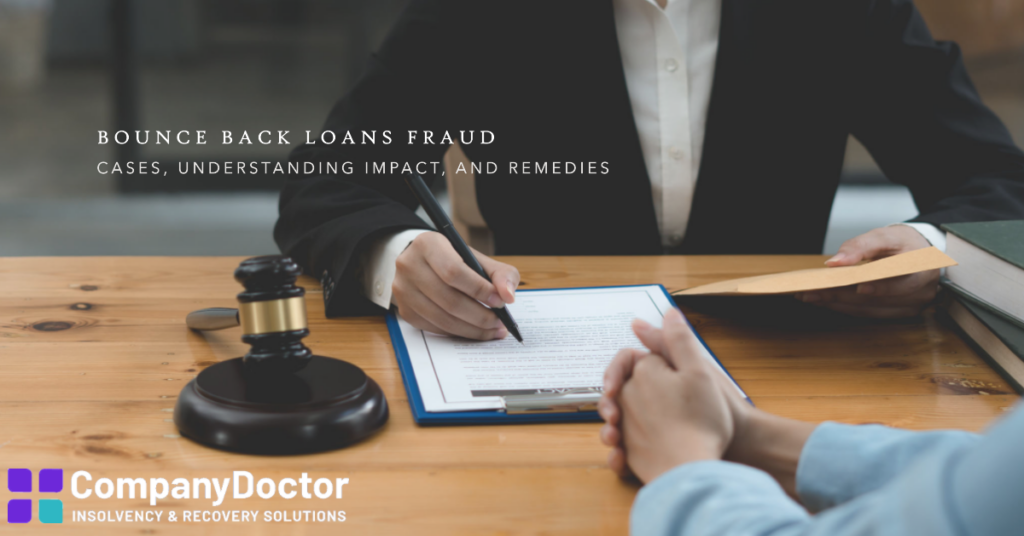 understanding bounce back loans fraud. a desk with someone signing document